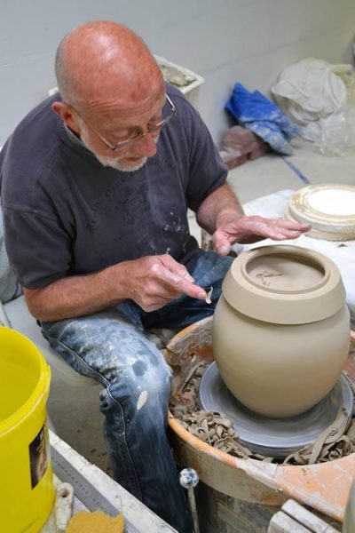 Ber van Reden, founder of the Netherlands Urn Centre acquired by Goedewaagen, turning an eight-kilo urn. Photo: Marijke Koster.
